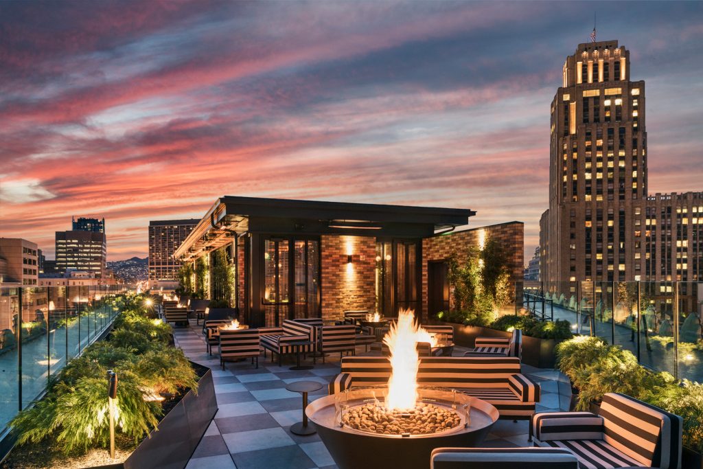 San Francisco Proper rooftop at sunset with fire pits and city skyline views