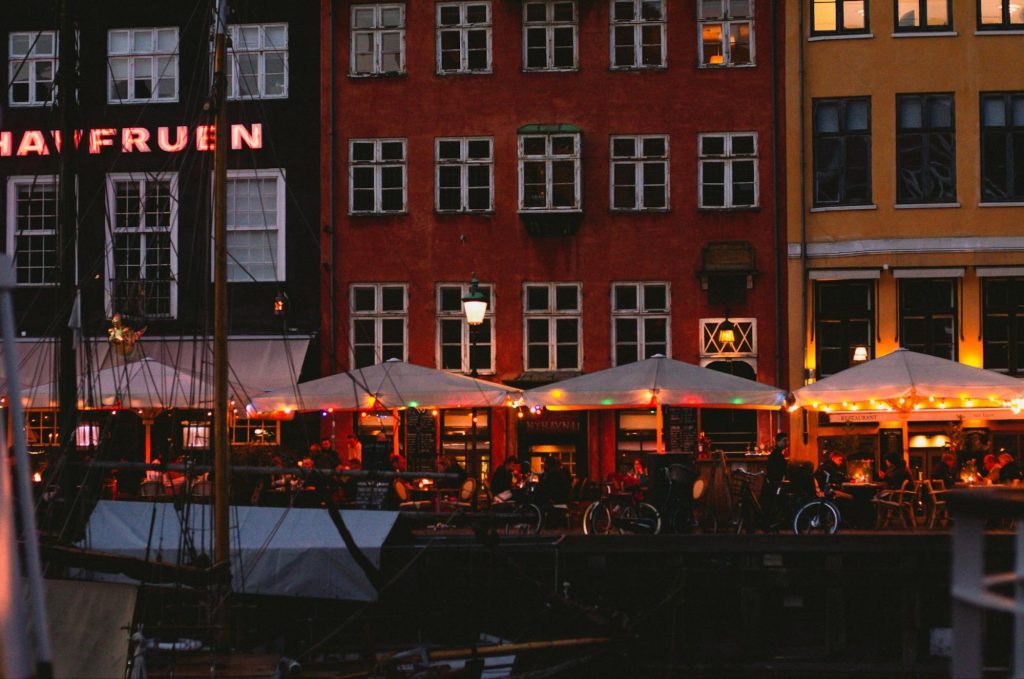 Outdoor restaurant terraces in Nyhavn Copenhagen at night