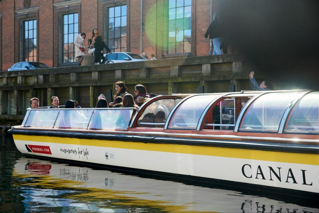 Tourists on canal boat tour in Copenhagen