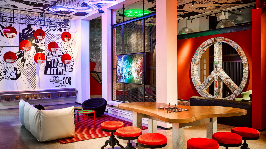 Hotel Zeppelin SF lounge with neon lights, street art, and peace sign