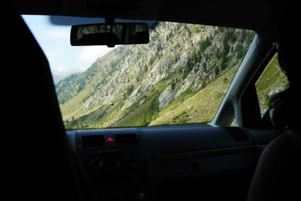 Driving through Swiss alpine mountain road