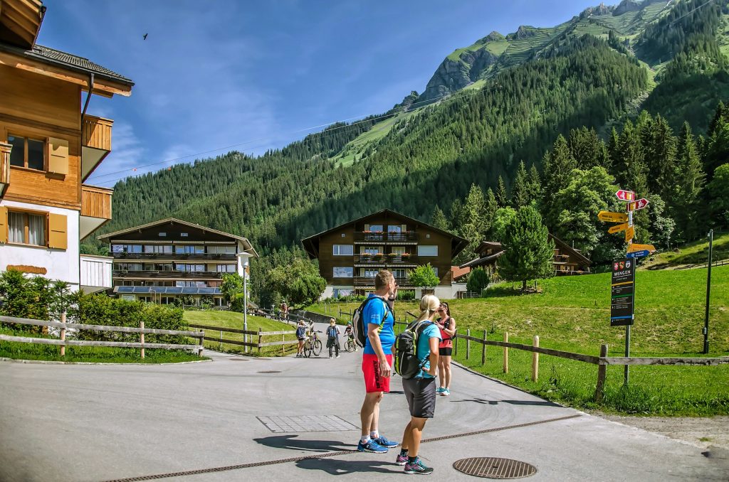Guided travelers in Swiss alpine village