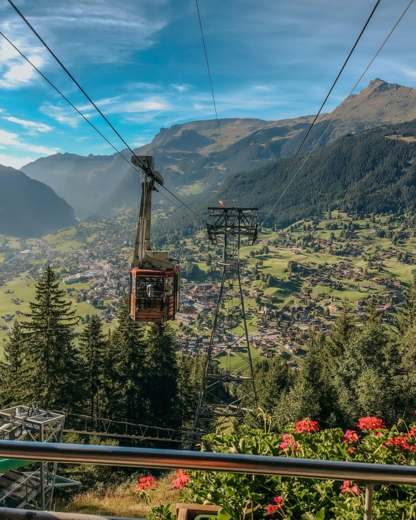 Swiss cable car above alpine valley